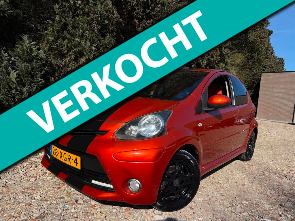 Toyota Aygo 1.0 VVT-i Dynamic Orange | Airco | Elek. Ramen, Euro 5, Gebruikt, Overige kleuren, 4 stoelen