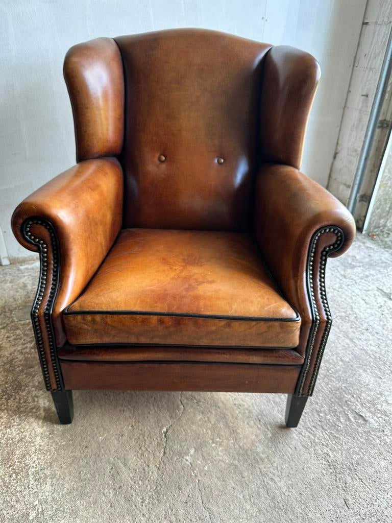 Schapenleren oorfauteuil. Lounge Atelier., Huis en Inrichting, Fauteuils, Ophalen, ., Leer, .