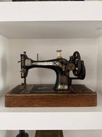 Antieke Singer naaimachine, Ophalen