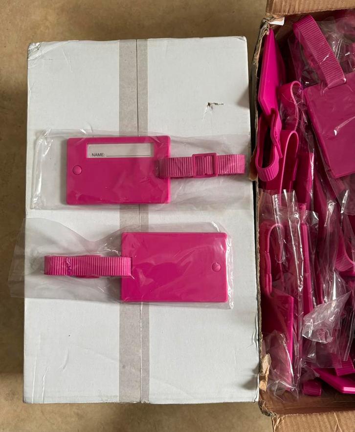 PARTIJHANDEL 50 stuks roze koffertags, Zakelijke goederen, Partijgoederen en Retail | Partijgoederen, Huis en Inrichting, Ophalen of Verzenden