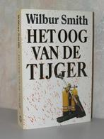 Wilbur Smith - Het oog van de tijger (parelpocket wit), Boeken, Ophalen of Verzenden, Zo goed als nieuw, Nederland