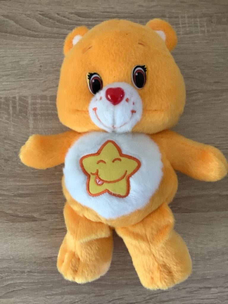 Care bears oranje troetelbeer ster op buik 2018 7,50 euro, Ophalen of Verzenden, Zo goed als nieuw, Overige typen