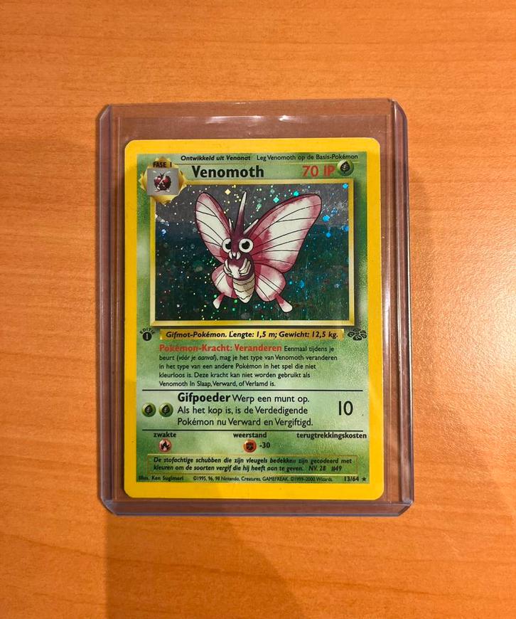 Venomoth Holo 1st Edition NL - Jungle #13/64, Hobby en Vrije tijd, Verzamelkaartspellen | Pokémon, Zo goed als nieuw, Ophalen of Verzenden