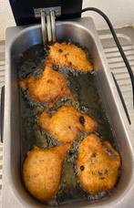 Oliebollen en appelbeignets te koop, Ophalen