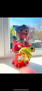 Vorlijk beeld vrouw met bananen, Ophalen