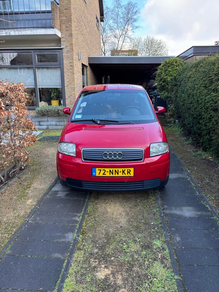 Audi A2 1.4 55KW 2004 Rood 191000 km, Auto's, Audi, Particulier, A2, ABS, Airconditioning, Bluetooth, Centrale vergrendeling, Climate control