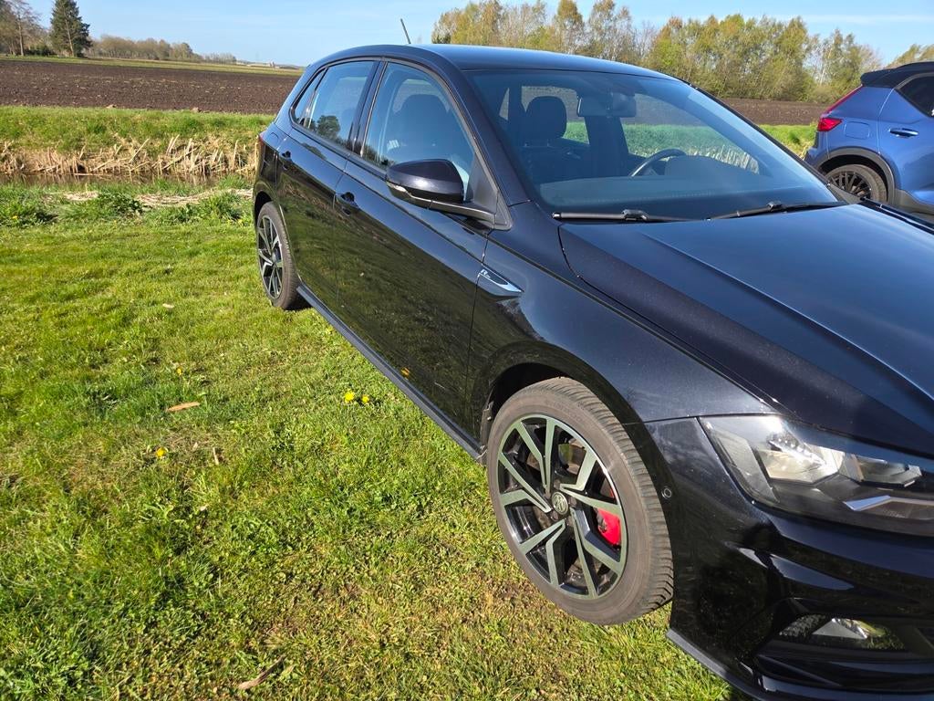 Volkswagen Polo Rline 1.0 TSI 115pk 2019 Zwart, Auto's, Voorwielaandrijving, Stof, Zwart, 1055 kg