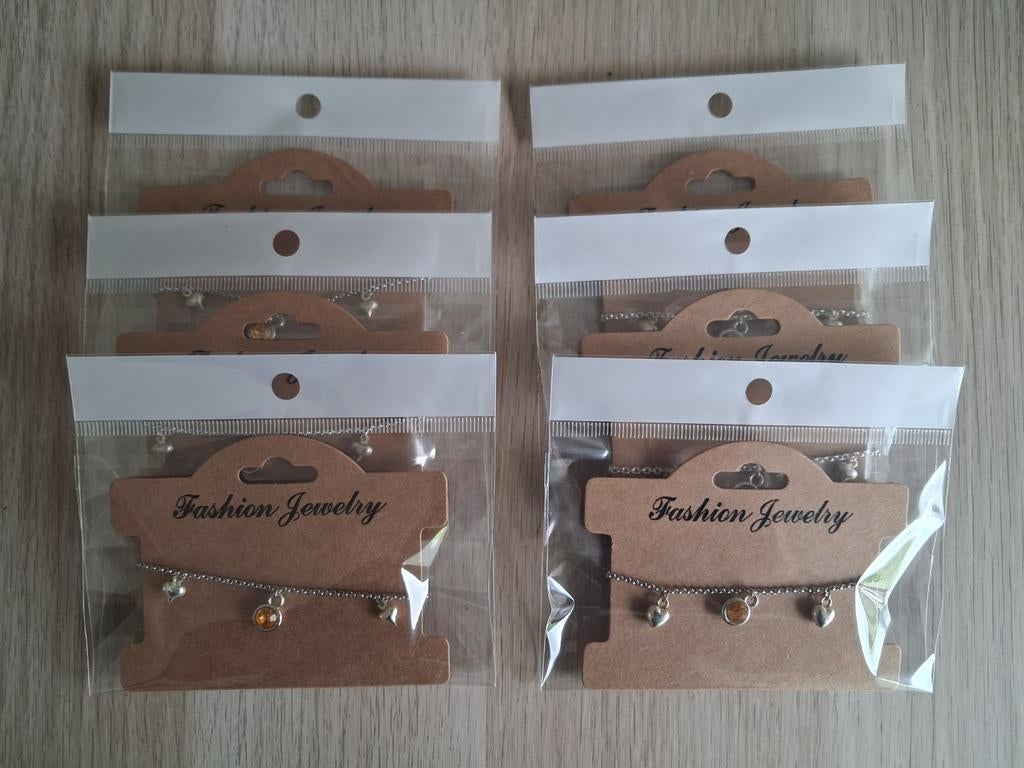 6x Kinderbedelarmbandjes - Zilverkleurig en Oranje, Sieraden, Tassen en Uiterlijk, Kindersieraden, Nieuw, Armband, Oranje, Ophalen of Verzenden