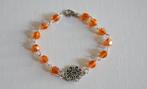 Armband met mooie oranje facetkralen en tussenzetsel, Ophalen of Verzenden, Nieuw, Oranje, Overige materialen