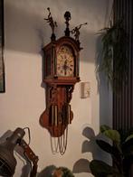 Friese staart klok, Ophalen