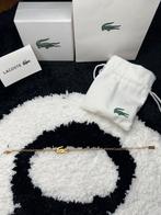 Lacoste armband dames goud, Sieraden, Tassen en Uiterlijk, Armbanden, Ophalen of Verzenden, Nieuw, Goud, Staal