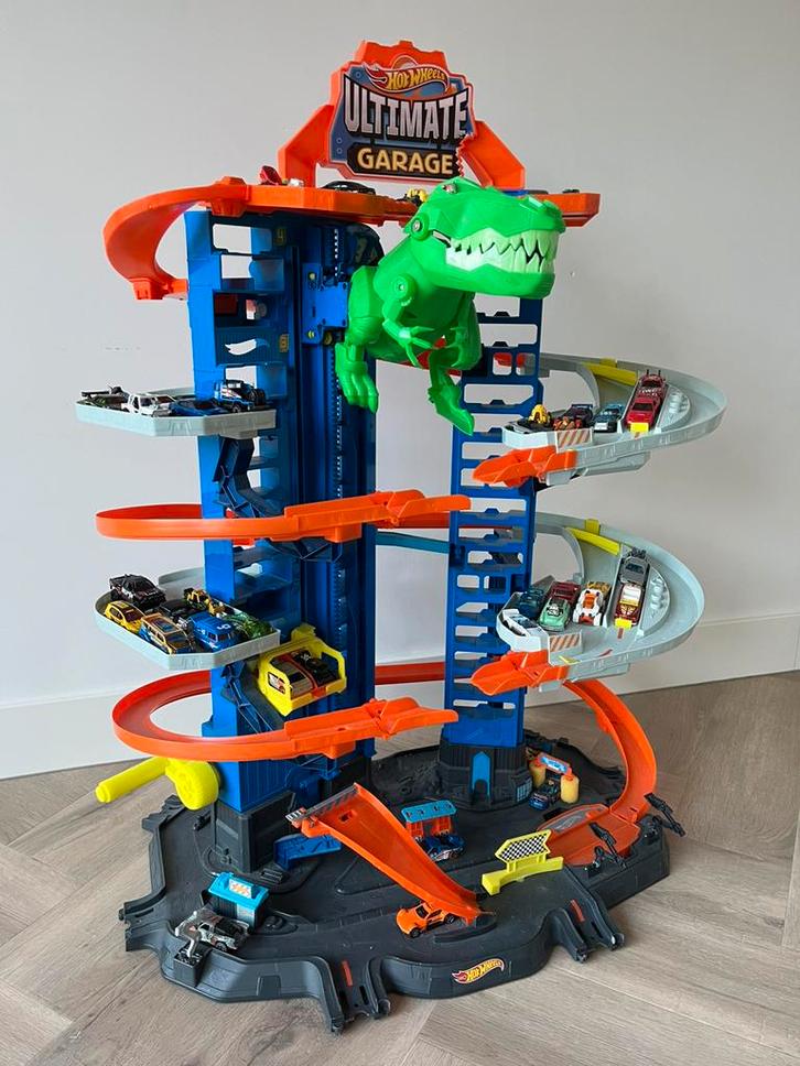 Hot Wheels Super Garage T‑Rex – inclusief 52 auto’s – Drunen, Kinderen en Baby's, Speelgoed | Speelgoedvoertuigen, Gebruikt, Ophalen