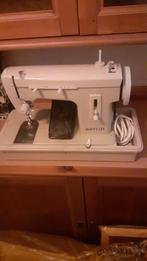 Naaimachine merrit, Ophalen