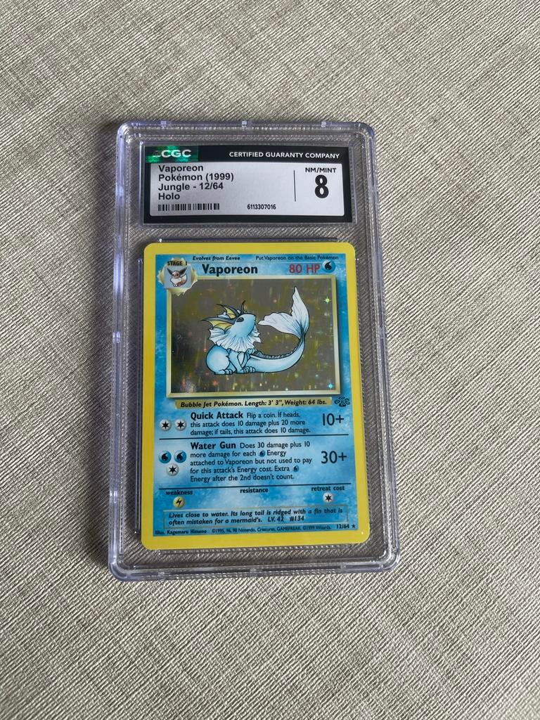 Vaporeon Holo Fossil 12/64 CGC 8, Ophalen of Verzenden, Zo goed als nieuw, Losse kaart, Foil