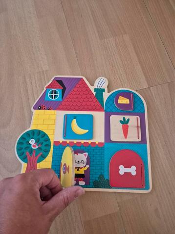 Janod houten puzzel met elastieken klepjes  beschikbaar voor biedingen