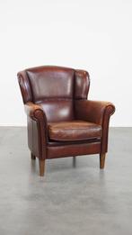 Karaktervolle schapenleren oorfauteuil met donkere kleuren, Huis en Inrichting, Fauteuils, Ophalen, Gebruikt, ., Klassiek