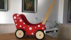 Houten poppenwagen rood met witte stippen., Kinderen en Baby's, Speelgoed | Houten speelgoed, Ophalen of Verzenden, Gebruikt, Duw- of Trekspeelgoed