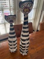 2 houten beelden van een kat, Ophalen