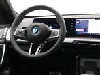 BMW iX1 eDrive20 Premium Pack | M-Sportpakket | Panoramadak, Auto's, BMW, Stof, Met garantie (alle), Zwart, 204 pk