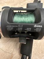 Zeehengel en reel okuma magda pro, Ophalen of Verzenden, Zo goed als nieuw, Molen