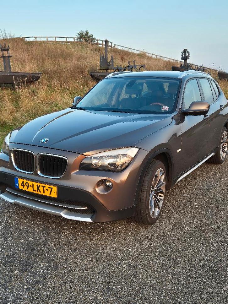 BMW X1 2.0 Sdrive 18I 2010 Bruin, Auto's, BMW, Particulier, X1, ABS, Adaptive Cruise Control, Airbags, Airconditioning, Bluetooth