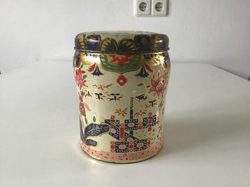 Art Deco blik CO-OP met bloemen beschikbaar voor biedingen