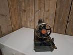 Antieke Singer handnaaimachine, Ophalen