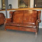 Hoge schapenleren bank met oren (Lounge Atelier), Ophalen