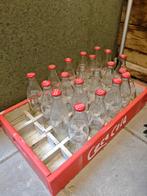 Coca cola krat met flessen, Ophalen