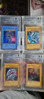 Graded Yu-gi-oh kaarten.1st editions en div kaarten, Sleeves of Kaarthoesjes, Foil, Ophalen of Verzenden, Zo goed als nieuw