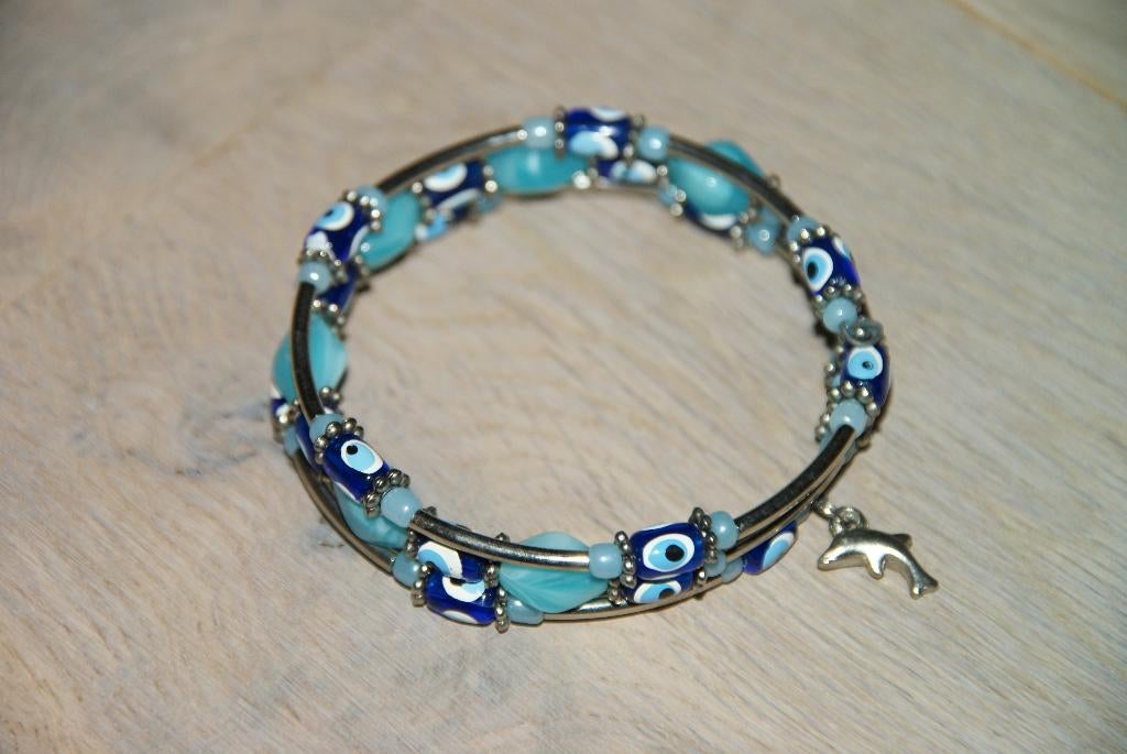 Te koop Armband, zilverkleur blauw dolfijn boze oog of Nazar, Overige materialen, Nieuw, Ophalen of Verzenden, Met bedels of kralen