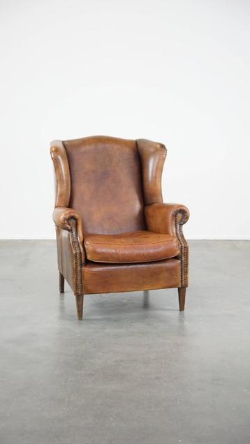 Grote schapenleren oorfauteuil met prachtige kleuren beschikbaar voor biedingen
