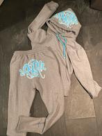 Synaworld Trainingspak Maat M, Ophalen, Zo goed als nieuw, Maat 48/50 (M), Grijs