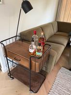 Drankkastje hout op wieltjes, Ophalen