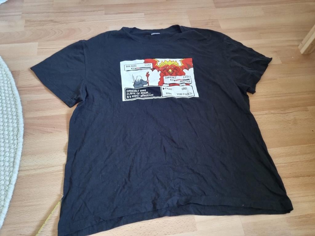 Lord of the Rings Gandalf vs Balrog T-shirt L heren, Maat 52/54 (L), Onbekend, Zwart, Ophalen of Verzenden