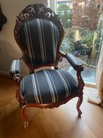 Antieke fauteuil met leeuwenkoppen, Ophalen