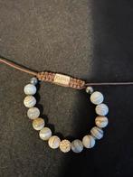 Karma armband, Sieraden, Tassen en Uiterlijk, Armbanden, Ophalen of Verzenden, Zo goed als nieuw, Bruin, Overige materialen