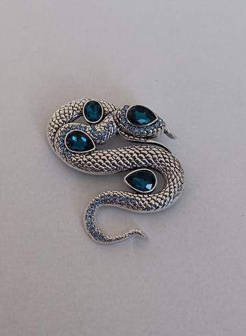 Slang broche beschikbaar voor biedingen