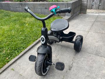 Leuke weinig gebruikte driewieler met duwstang beschikbaar voor biedingen
