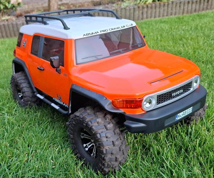 Absima Toyota FJ cruiser, Hobby en Vrije tijd, Modelbouw | Radiografisch | Auto's, Zo goed als nieuw, Auto offroad, Elektro, Schaal 1:10