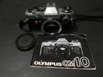 Olympus OM-10 met manual adapter, Audio, Tv en Foto, Fotocamera's Analoog, Ophalen of Verzenden, Gebruikt
