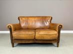 Elegante schapenleren 2 zits bank DNG in vintage staat, Huis en Inrichting, Banken | Sofa's en Chaises Longues, Ophalen, Gebruikt
