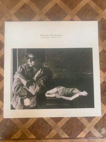 Paul Young - Between Two Fires LP beschikbaar voor biedingen