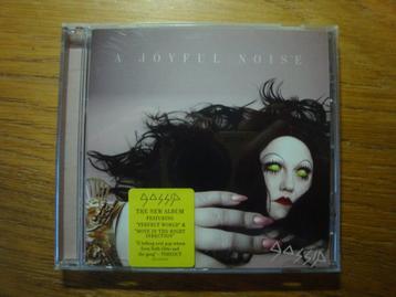 Gossip - A Joyful Noise (pop rock / glam) beschikbaar voor biedingen