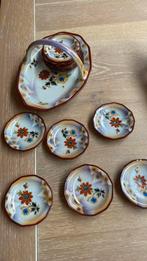 Pindaset met 12 schaaltjes, Ophalen