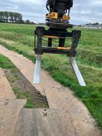 Hydraulische verstelbare palletvorken van Engcon, Ophalen