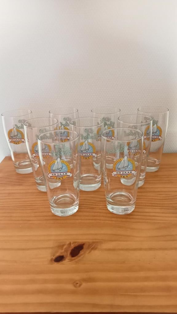 9x Bierglazen Skûtsjesilen 60 Jaar Lustrumjaar, Ophalen, Zo goed als nieuw, Bierglas