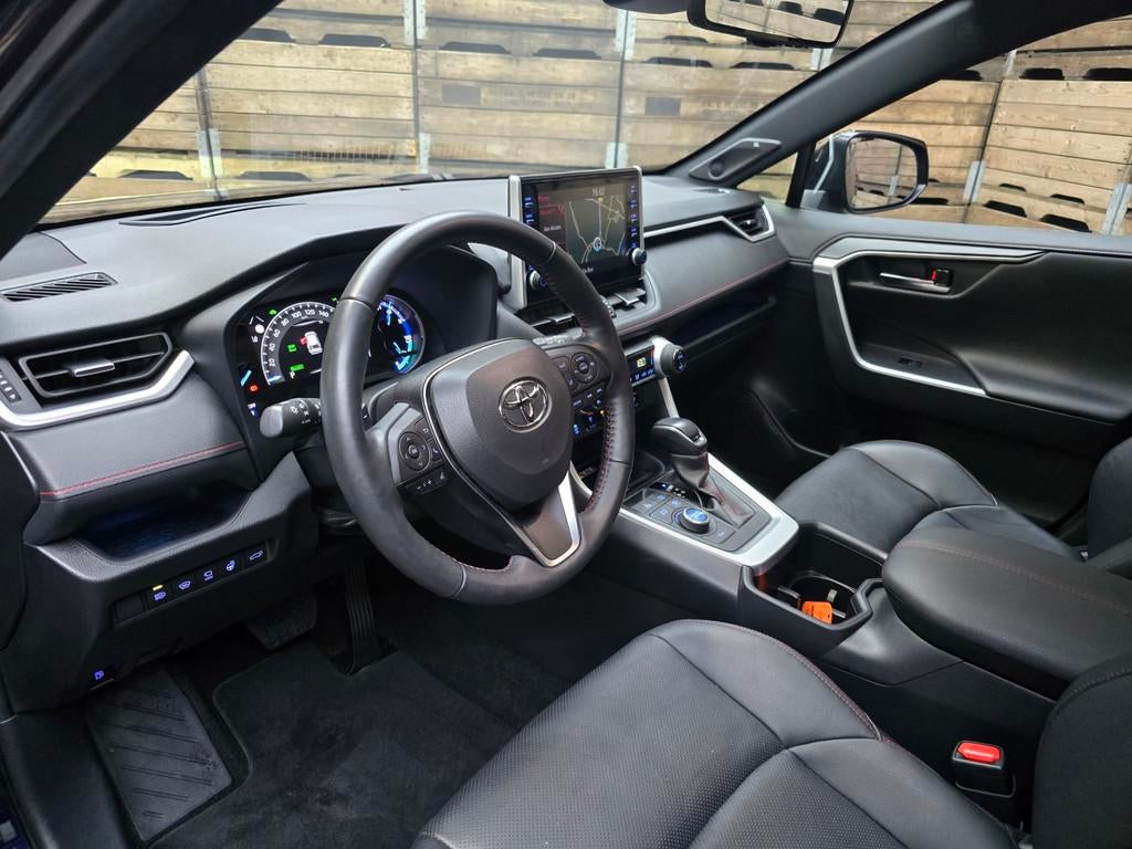 Toyota RAV4 2.5 Plug-in Hybrid AWD Business Plus, Auto's, Toyota, Gebruikt, Zwart, Blauw, Leder