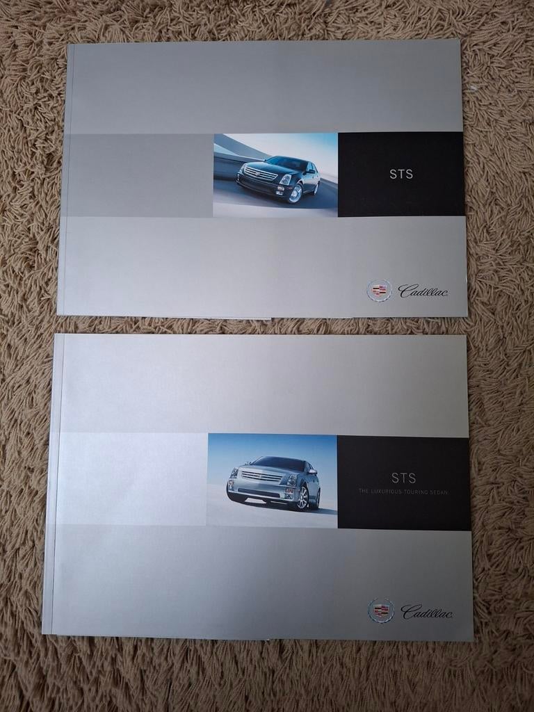 2x autofolder Cadillac STS, Verzenden, Zo goed als nieuw, Overige merken