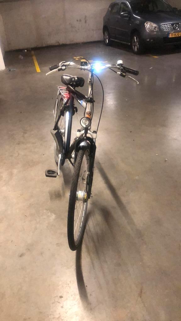 Te koop een mooie blauwe grijs herenfiet phoenix 28 inch, Fietsen en Brommers, Elektrische fietsen, Zo goed als nieuw, Overige merken